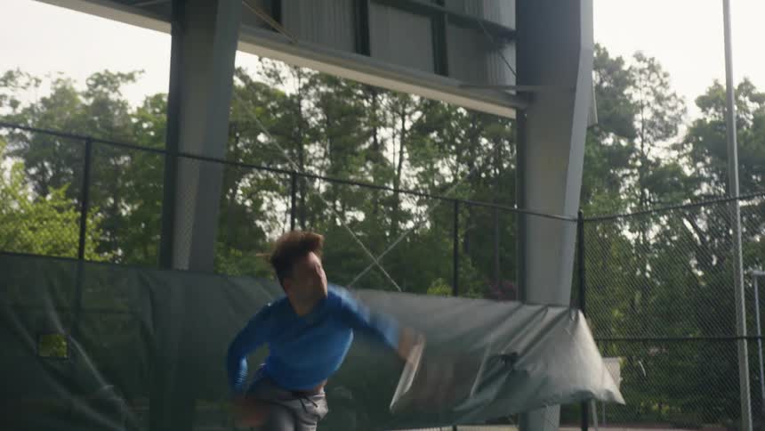 Tennis player suffers an elbow injury while serving a ball in the court