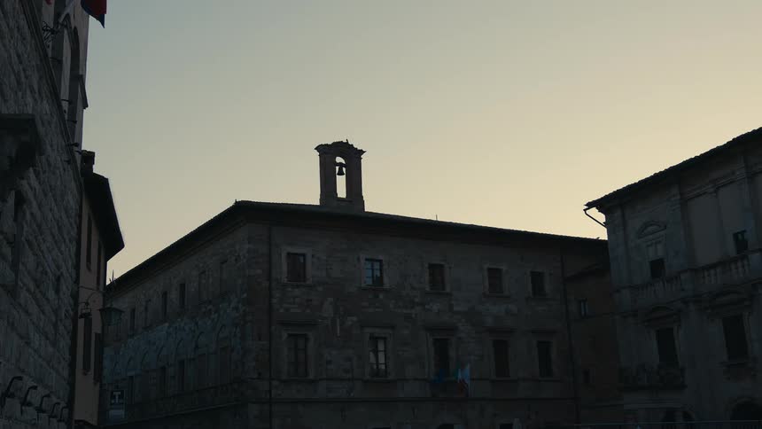 A bell is at the top of the building