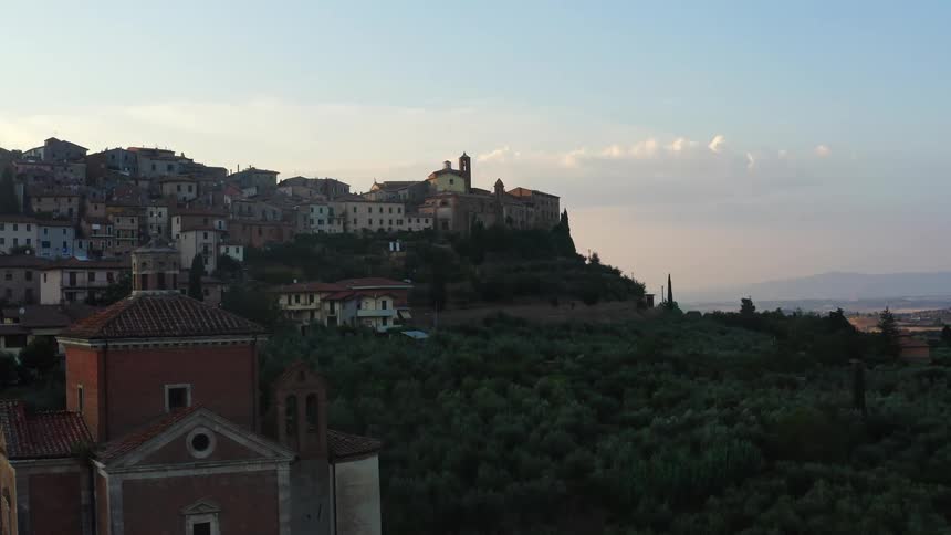 A skyline with a church and buildings on a hill