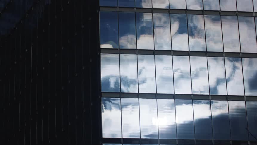 Clouds in the sky reflected on a building