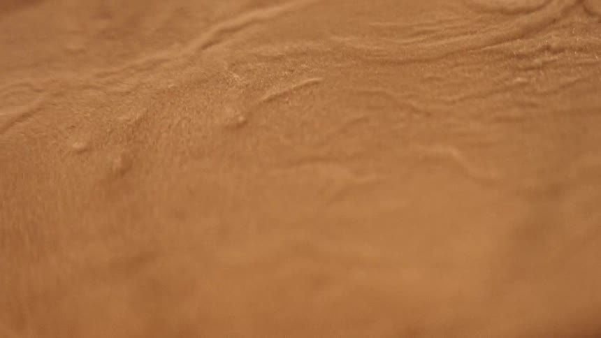 The sand vibrates and jumps around