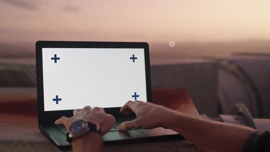 Person taps on laptop keyboard