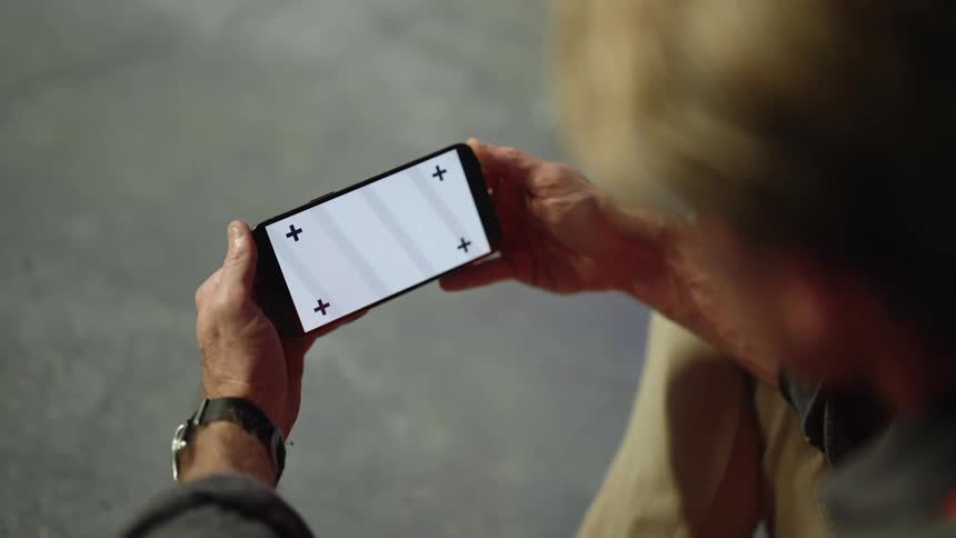 Watching a video on a cell phone outdoors