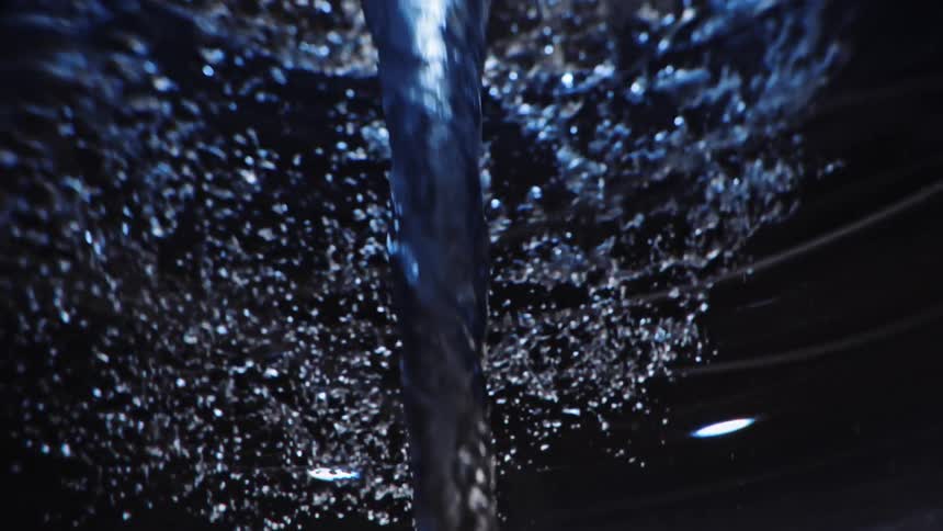Underwater close up of a twisting water vortex