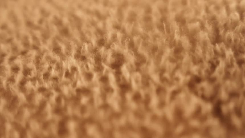 A vibrating light shines on a gold surface and it boils and splashes as the strobe flashes then melts back down