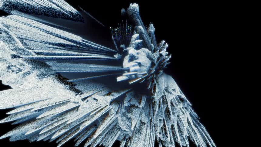 A statue is standing in the darkness and it turns into long shards extending into the night
