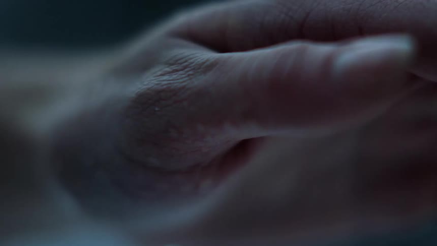 Close up of cold and shaky hand and arm