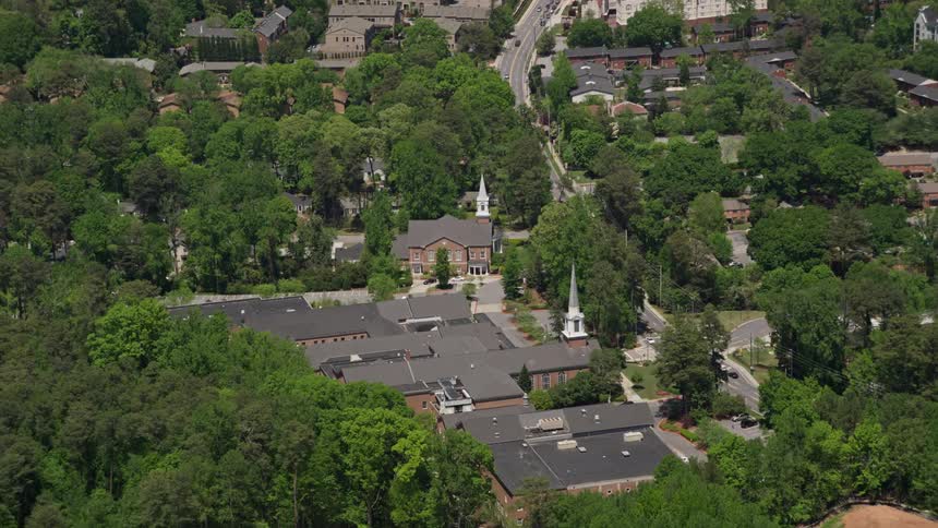 Approaching a serene church nestled among trees in Buckhead Georgia on a sunny day
