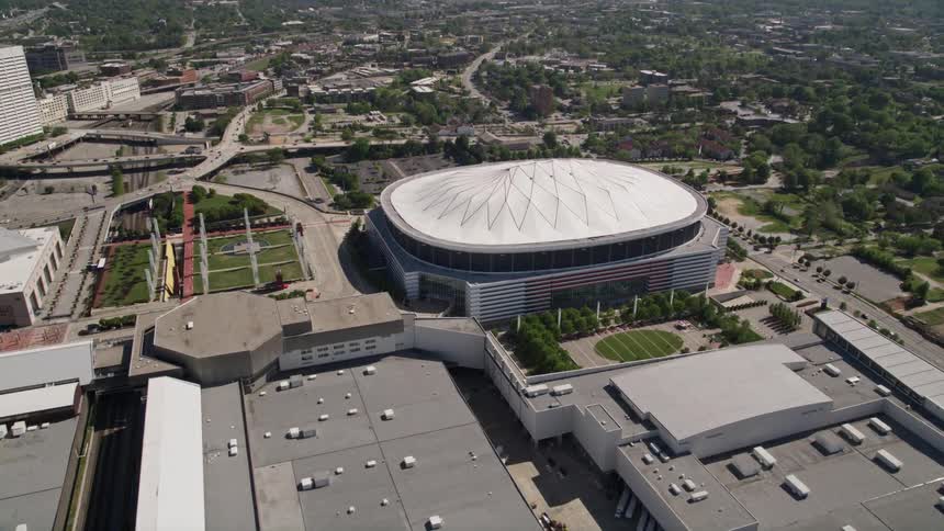 An aerial footage of Georgia Dome from the Centennial Place Elementary School in a residential neighborhood in Atlanta during daytime