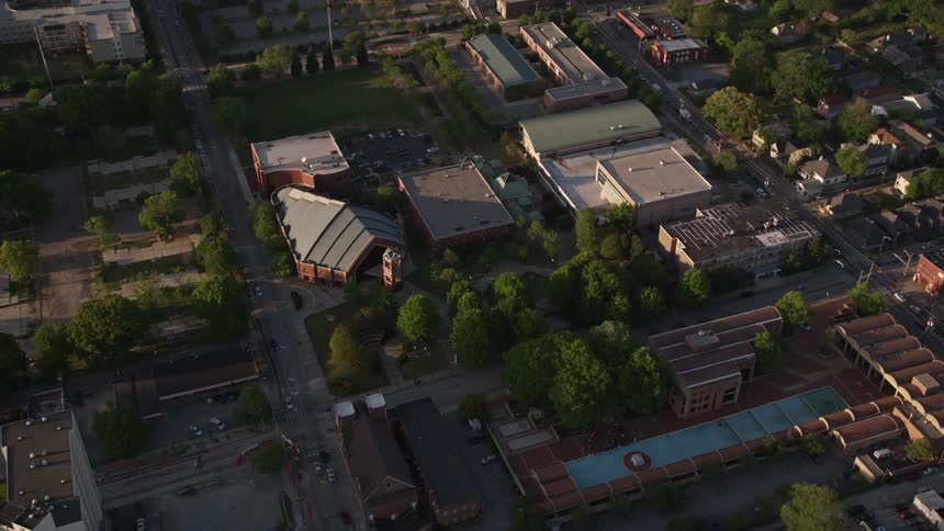 Aerial footage of Martin Luther King Jr National Historic Site in Atlanta Georgia during daytime with a view of the memorial fountain and surrounding landmarks