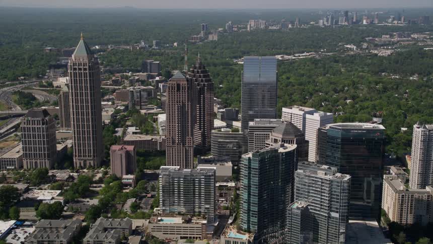 Flying over skyscrapers in Midtown Atlanta Georgia on a sunny day