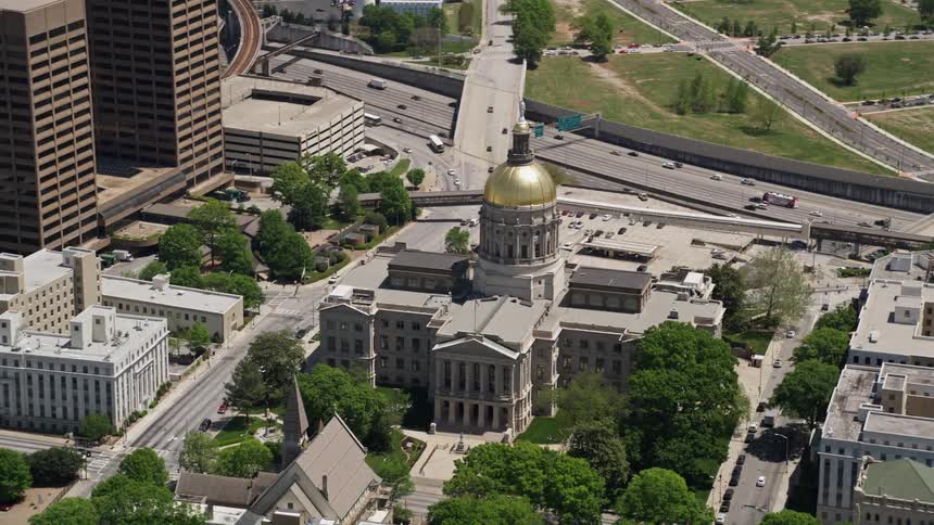 Aerial footage orbiting the Georgia State Capitol in downtown Atlanta during daytime