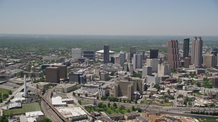 A stunning aerial view of Downtown Atlantas towering skyscrapers and office buildings during a sunny day in summer