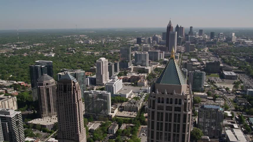 Flyby footage of Midtown Atlanta skyscrapers revealing One Atlantic Center and other superstructures in sunny daytime