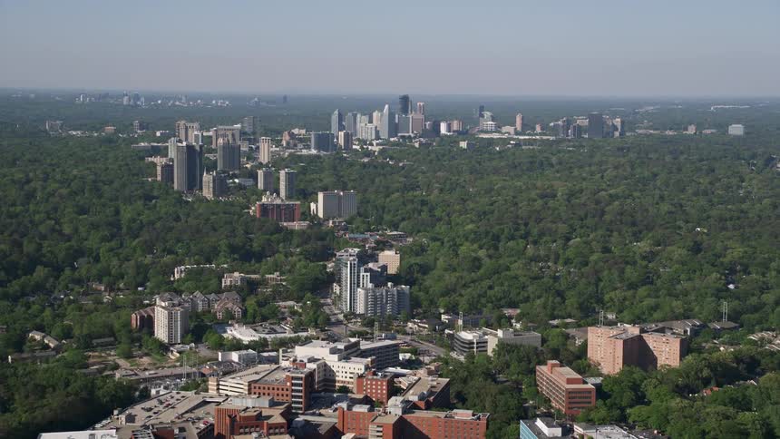 Aerial view of skyscrapers surrounded by forests in Buckhead Georgia during daytime