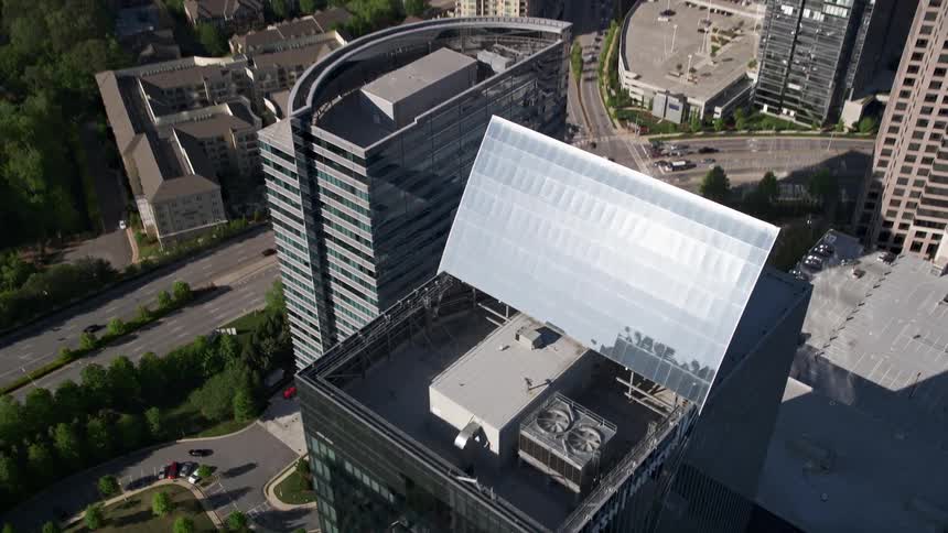 Aerial view of the Marsh Mercer building in Buckhead Georgia tilting down to birds eye perspective
