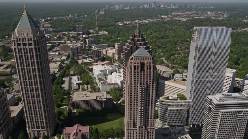 Flying over GLG Grand and revealing a birds eye view of Promenade II among other skyscrapers in Midtown Atlanta