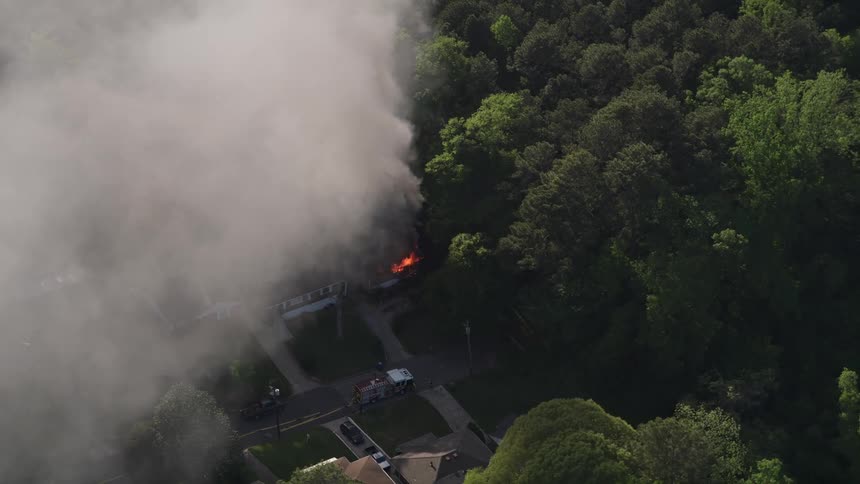 Smoke rises from a burning house in West Atlanta as footage captures aerial view
