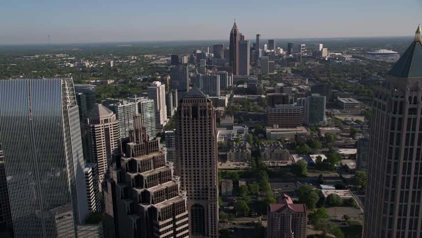 A stunning aerial view of Midtown Atlantas modern high-rise office and apartment buildings during a sunny day