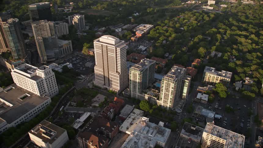 Approaching 999 Peachtree Street and its condominium complex in Midtown Atlanta during a hazy sunset