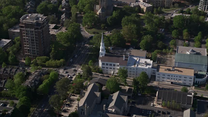 Approaching the Cathedral of Christ the King an aerial view of the Catholic church amidst condominium complexes in Buckhead Georgia
