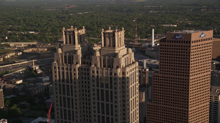 Aerial footage of downtown Atlanta with Westin Peachtree Plaza Hotel and 191 Peachtree Tower visible shot during daytime