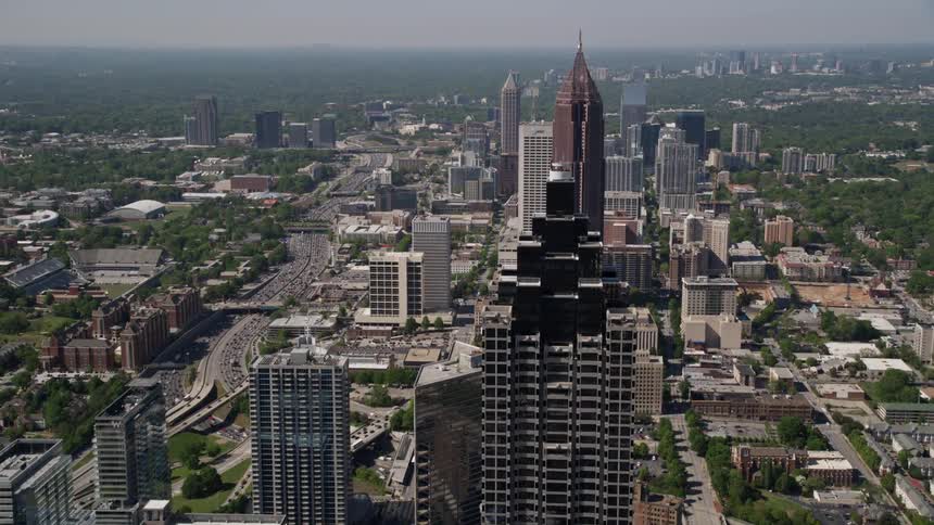 Flying over the high-rise skyscrapers of Midtown Atlanta Georgia on a sunny day