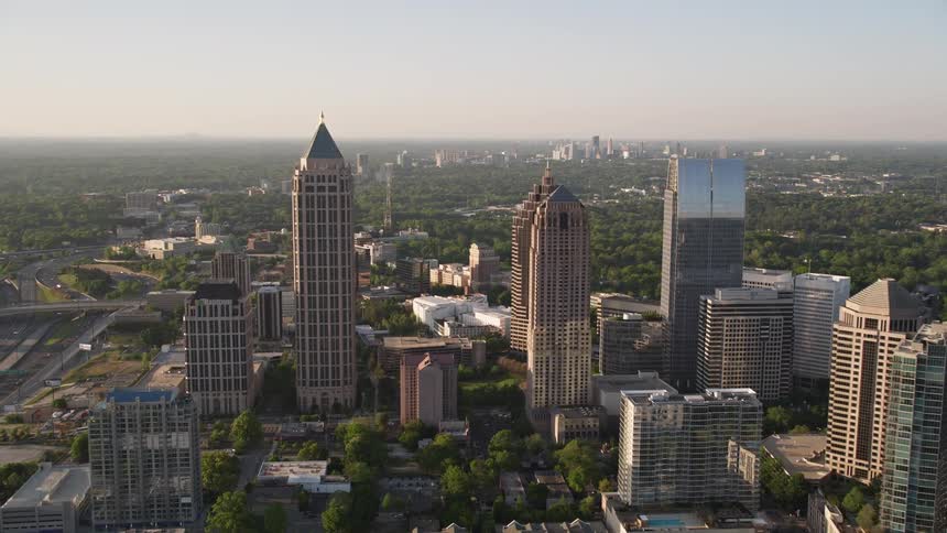 Approaching Midtown Atlanta skyscrapers at sunset revealing Promenade II and other modern buildings