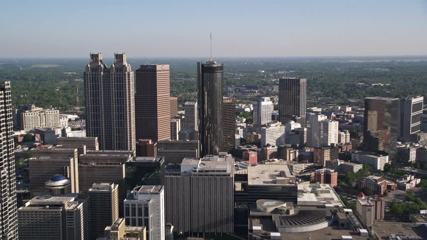 Approaching the Westin Peachtree Plaza Hotel in downtown Atlanta during a sunny day