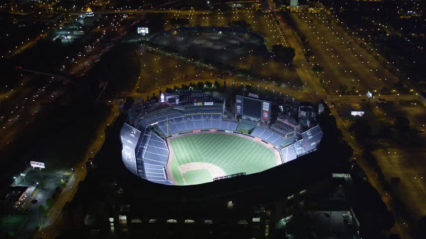 An aerial view of Turner Field at night with a tilt revealing the Downtown Atlanta skyline