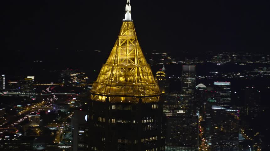 A breathtaking aerial view of Bank of America Plaza in Midtown Atlanta Georgia at night showcasing the citys skyline and urban lights