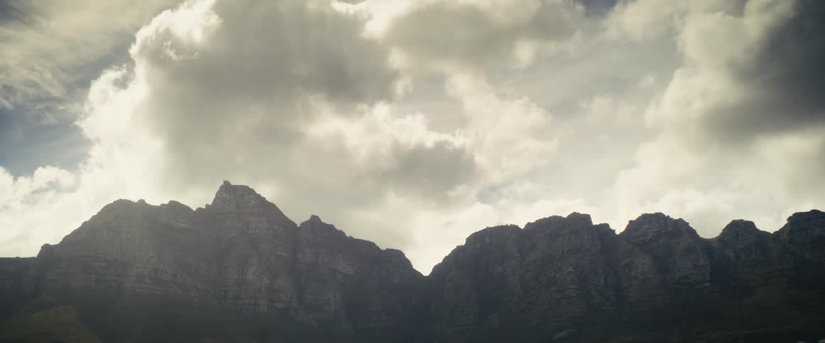 Clouds move over a mountain ridge