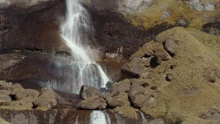 Slow motion view of a waterfall is displayed
