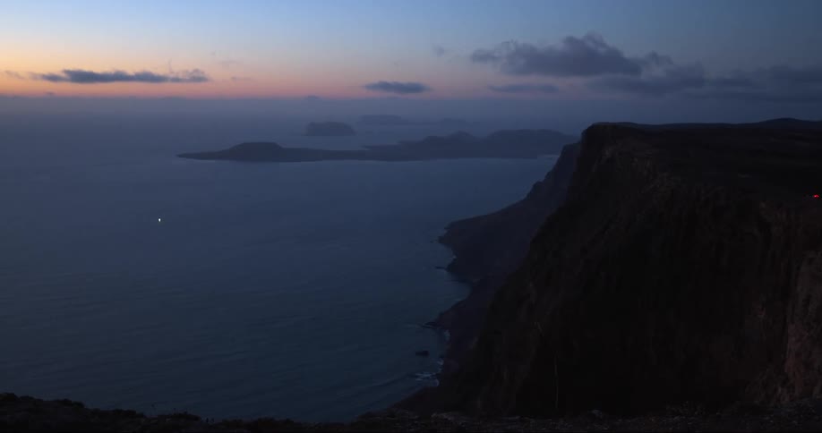 The sun is setting on the coast