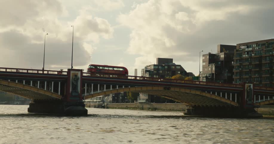 Traffic drives over Vauxhall Bridge over the River Thames