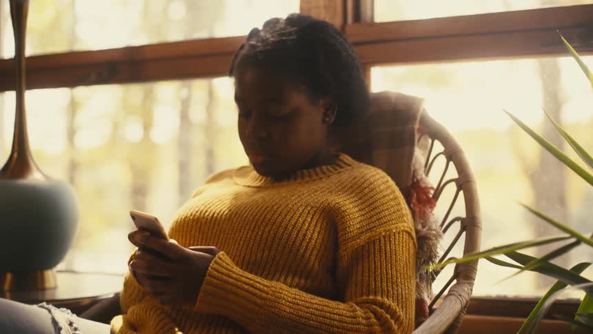 A view of a woman using a smartphone