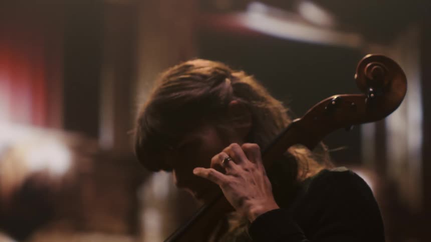 A woman playing a cello