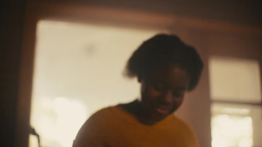A girl is playing an instrument and dancing