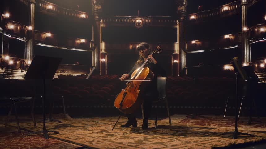 A woman is playing the cello