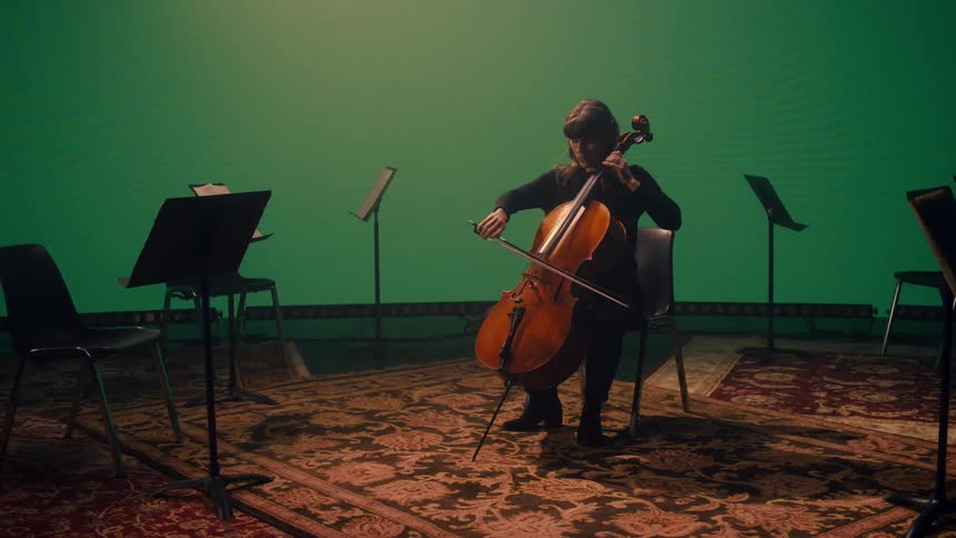 A woman is playing the cello