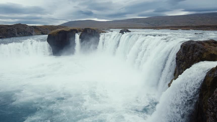 The view is of the ocean and you can see waterfalls
