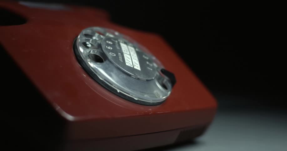 The rotary dial on a phone spins on its own