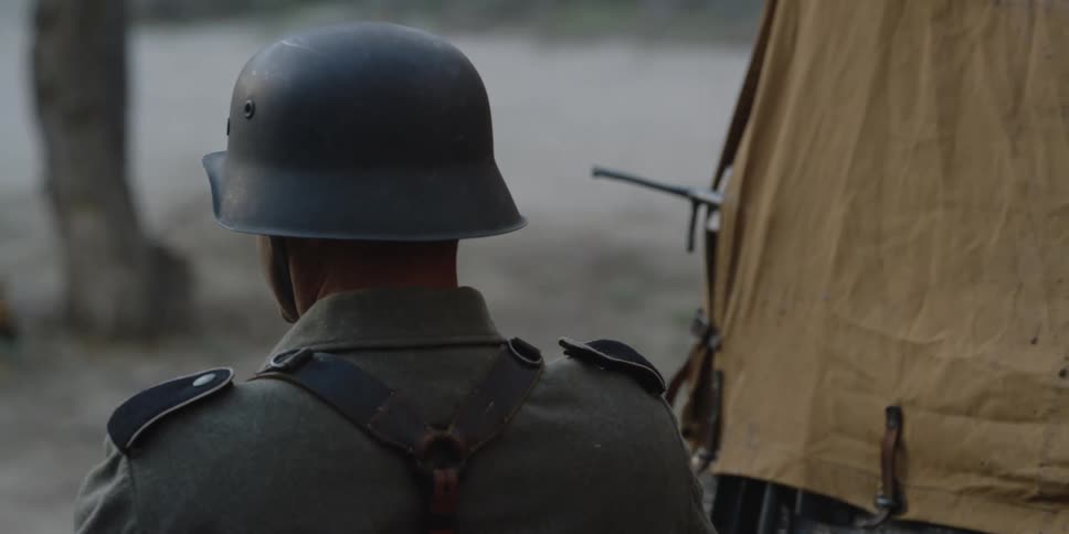 A soldier is watching his dog