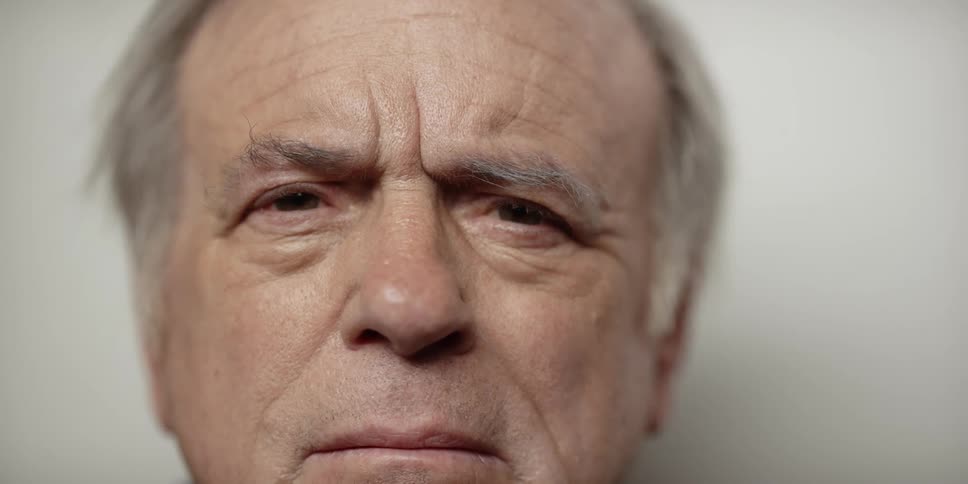 A man looks scared as he looks at the camera