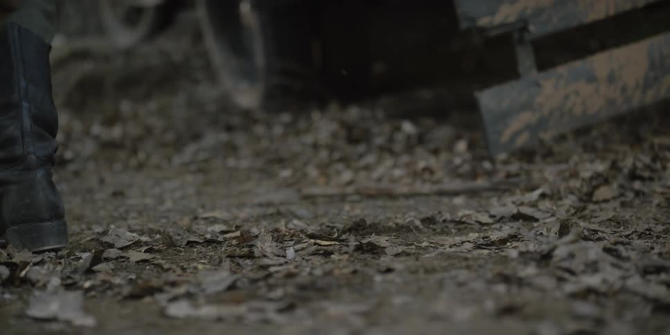 Soldiers in black boots jumping out of a parked vehicle