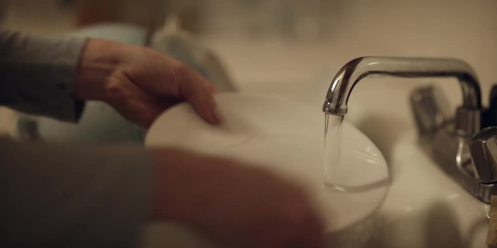 A person is washing dishes