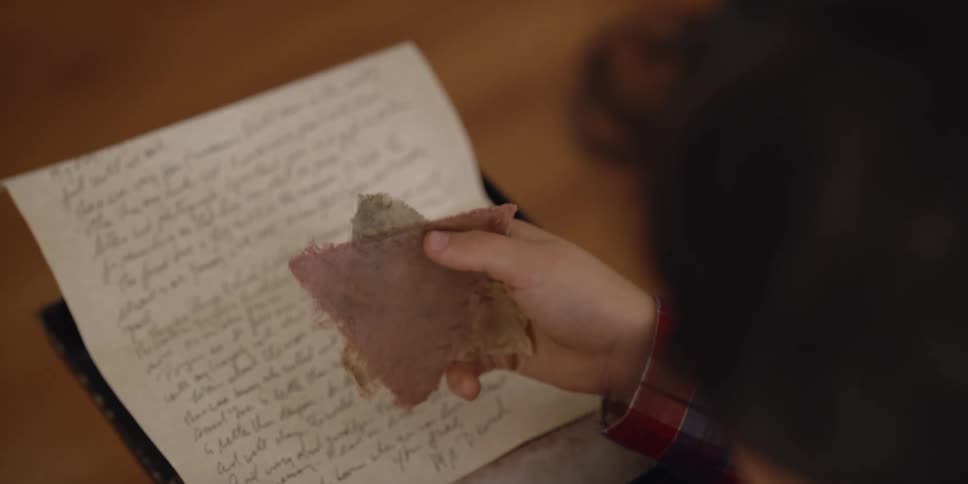 A man reads a handwritten letter
