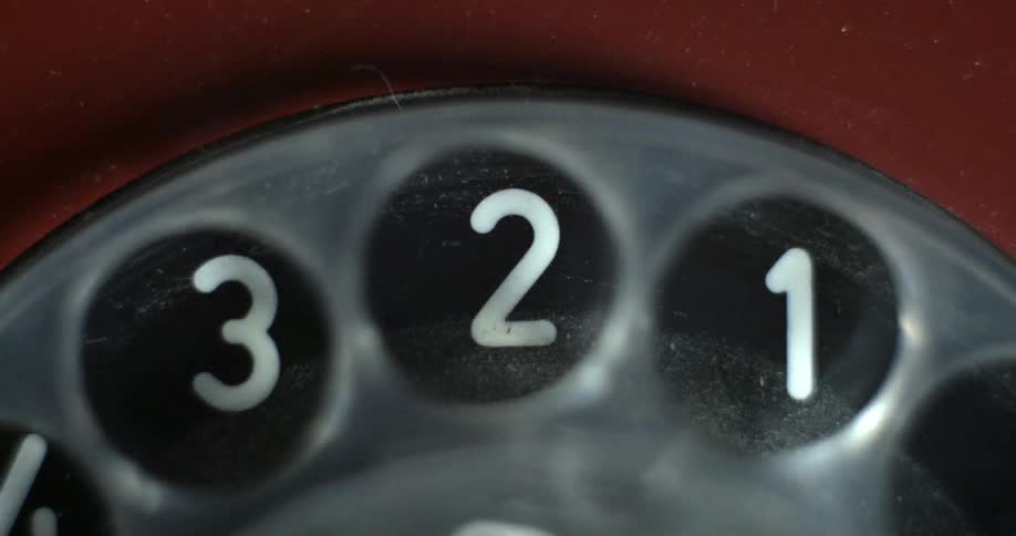A phone dial turns over numbers