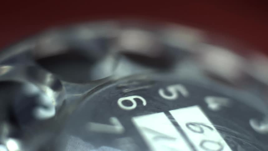 Someone dialing a rotary phone