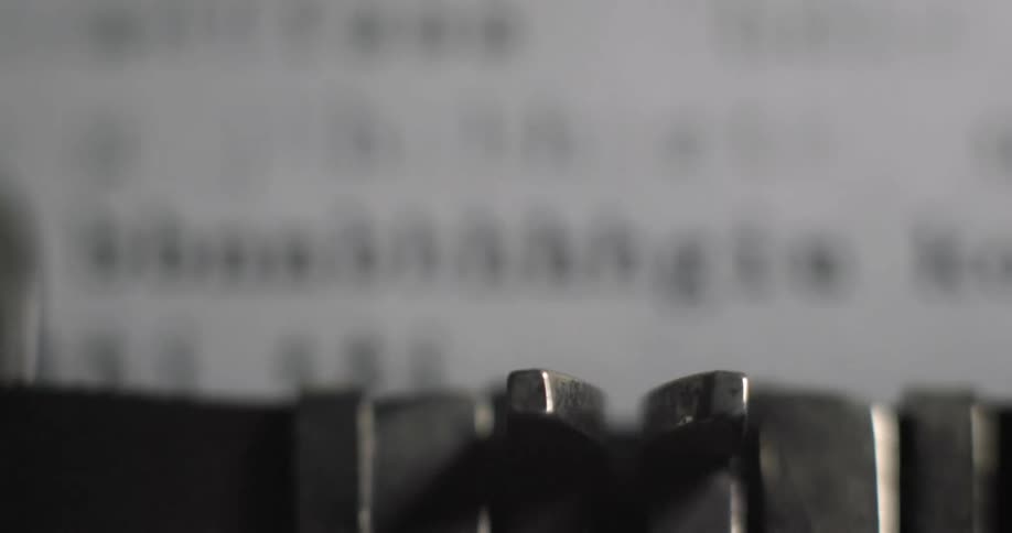A typewriter is being used